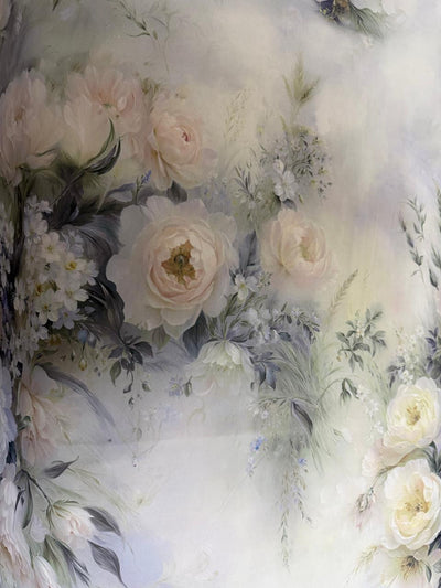 Floral arrangement with white and light pink roses on a soft, blurred background